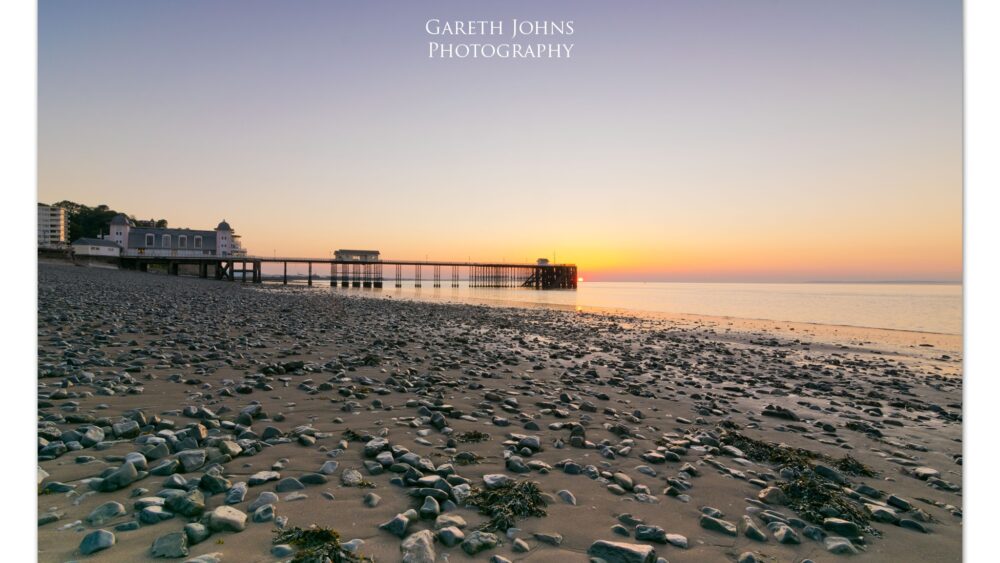 Golden sunrise over the Victorian Penarth Pier in the Vale of Glamorgan