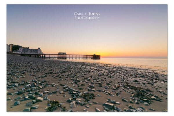 Golden sunrise over the Victorian Penarth Pier in the Vale of Glamorgan