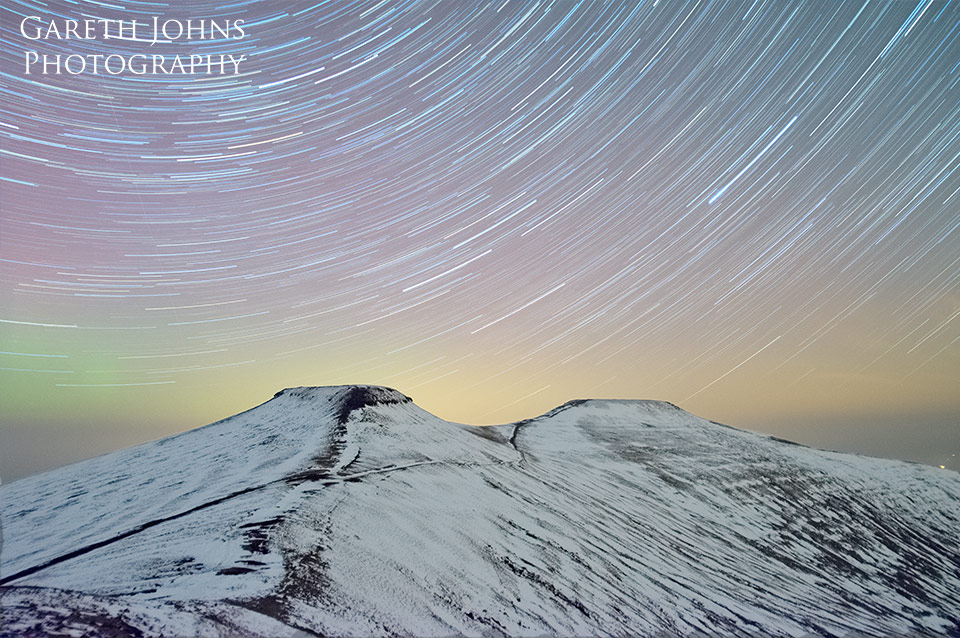 Corn Du and Pen y fan star trail with aurora borealis